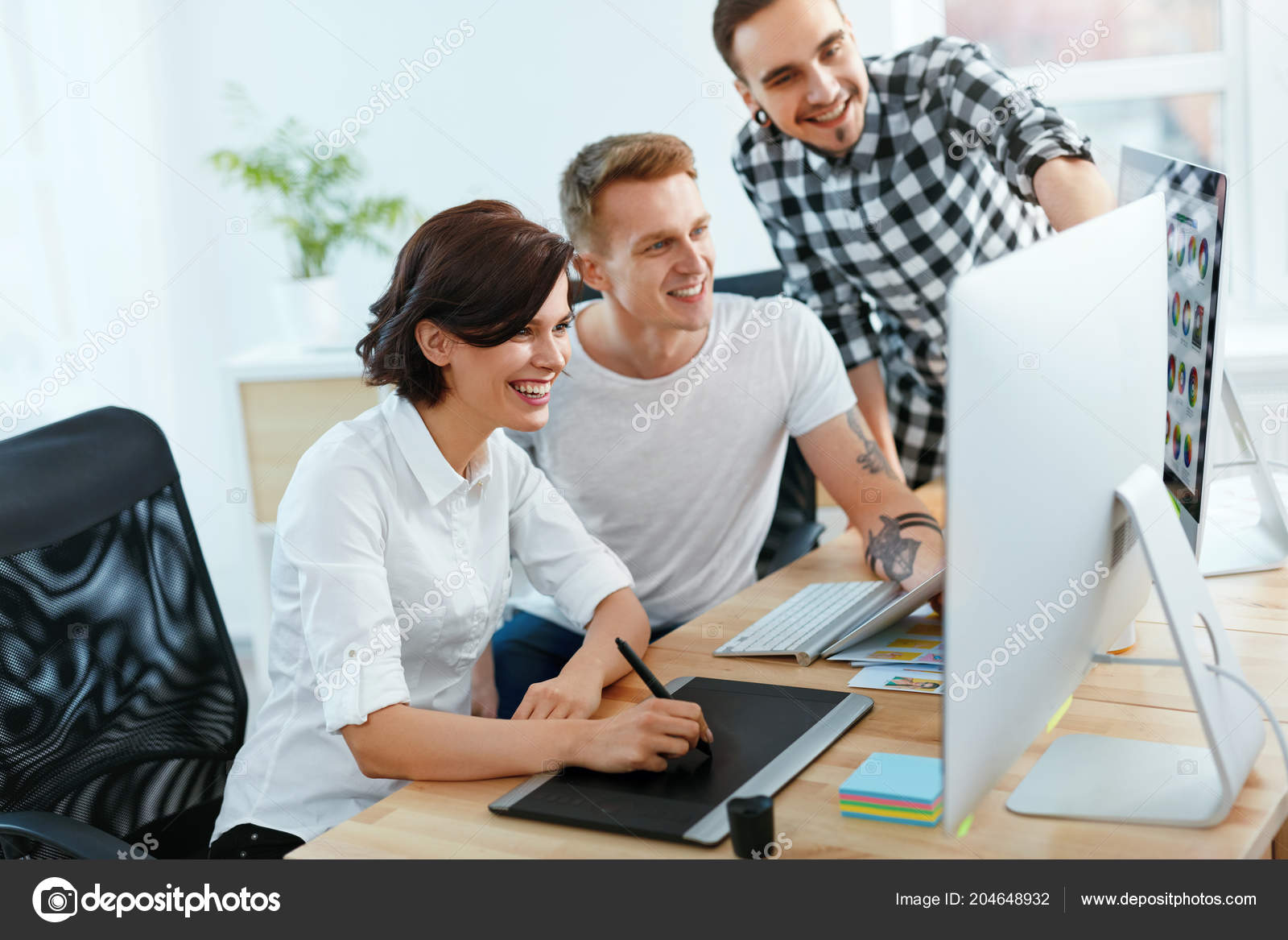 Team Of People Working On Computer In Office